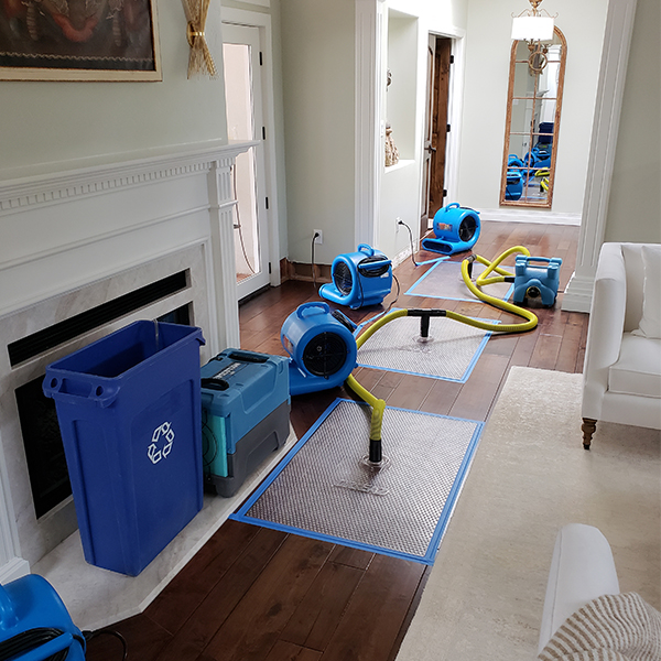 Water damage technician inspecting moisture levels in an Anaheim Hills home